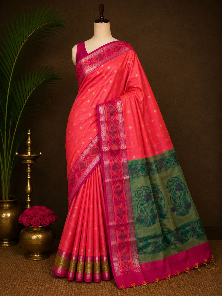 Coral pink party wear saree with small motifs and teal green pallu