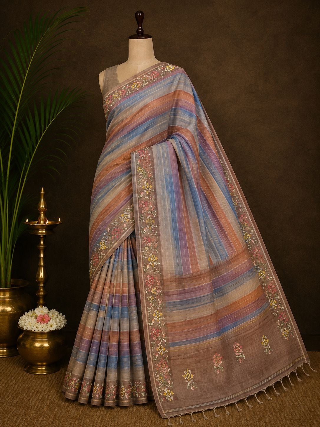 Dusty blue and terracotta striped party wear saree with floral border