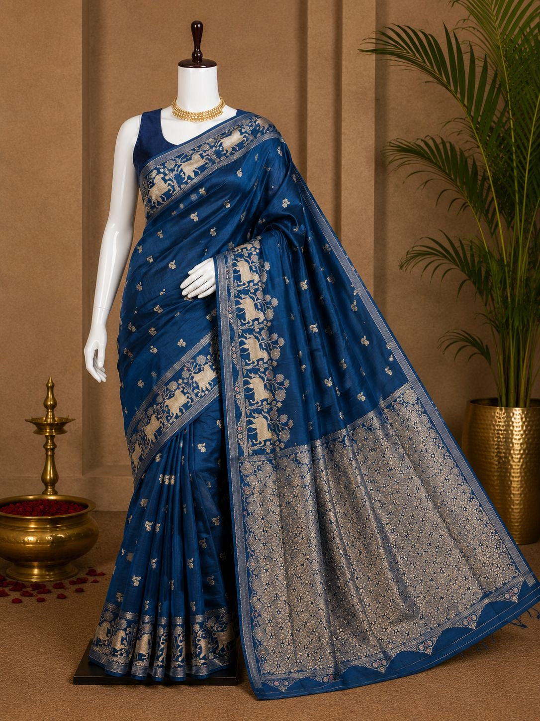 Indigo blue party wear saree with silver elephant border and floral woven pallu