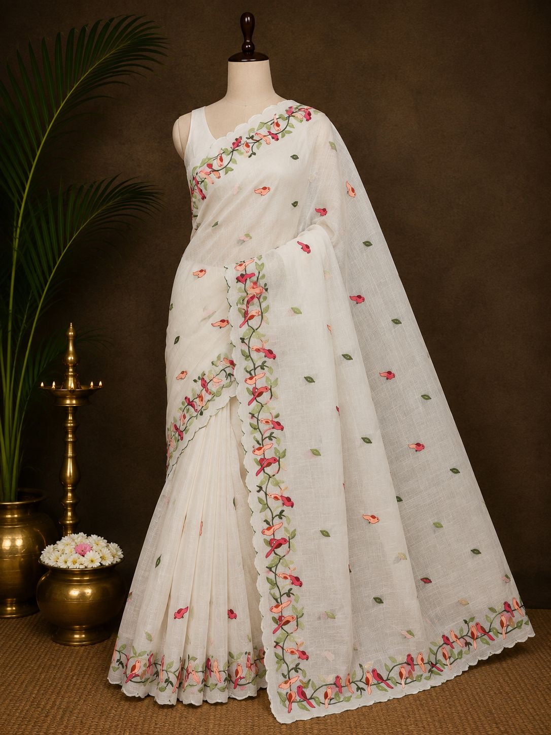 Ivory bird embroidered party wear saree in studio presentation