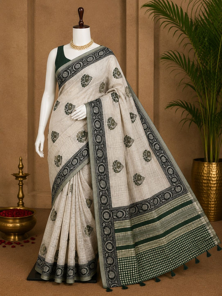 Ivory party wear saree with forest green medallions, floral border and checked pallu