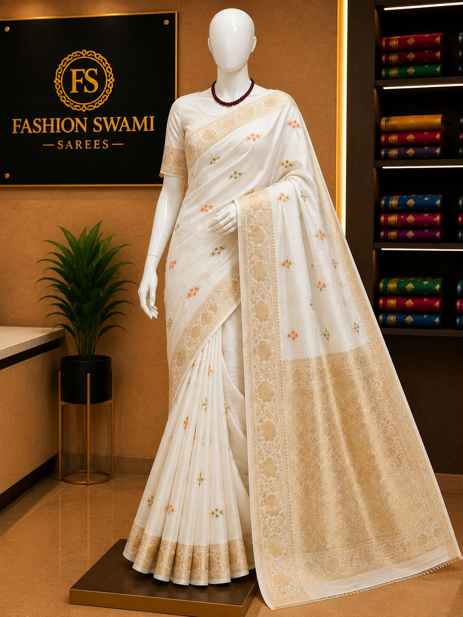 Ivory party wear saree with delicate multicolour butis and grand gold pallu